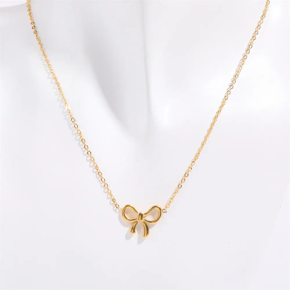 Collier avec pendentif en forme de nœud en acier titane - Les secrets de Cath