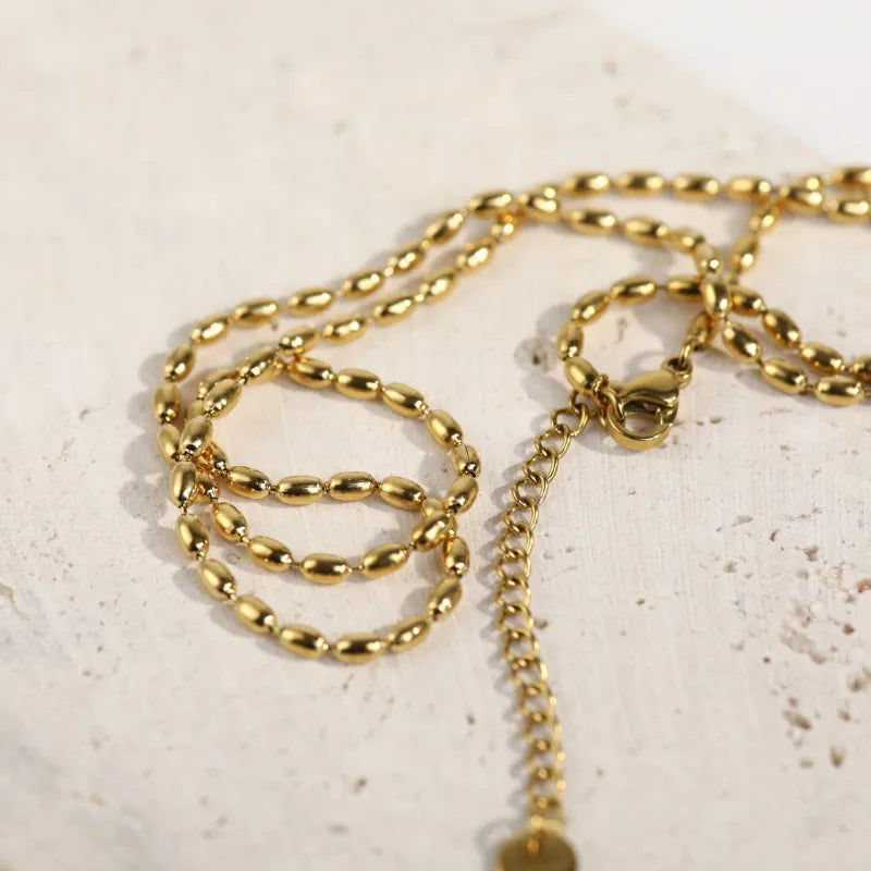 Collier de perles en acier titane - Les secrets de Cath