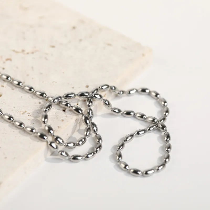 Collier de perles en acier titane - Les secrets de Cath