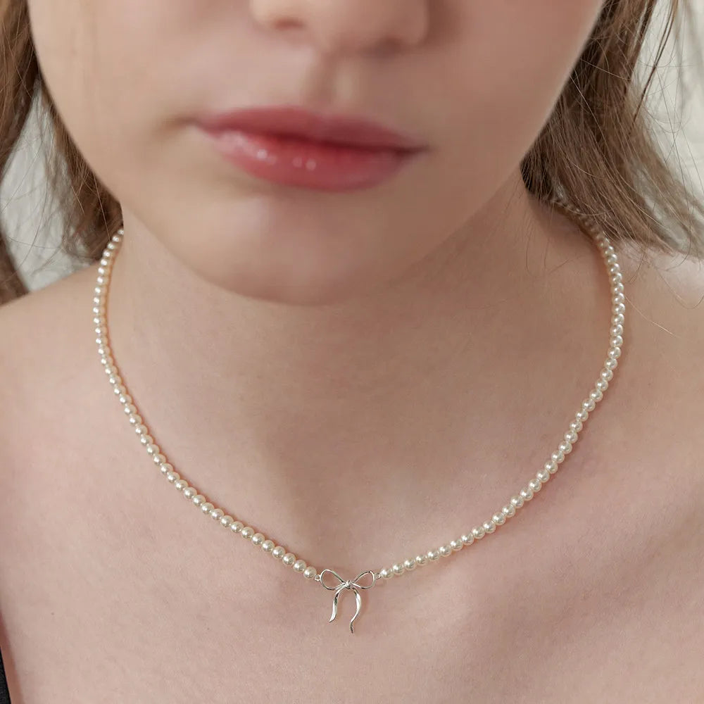 Collier nœud en perles de cuivre - Les secrets de Cath