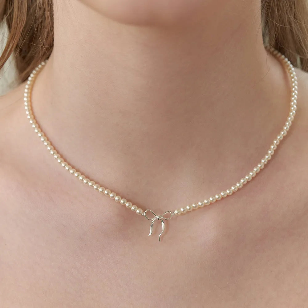 Collier nœud en perles de cuivre - Les secrets de Cath