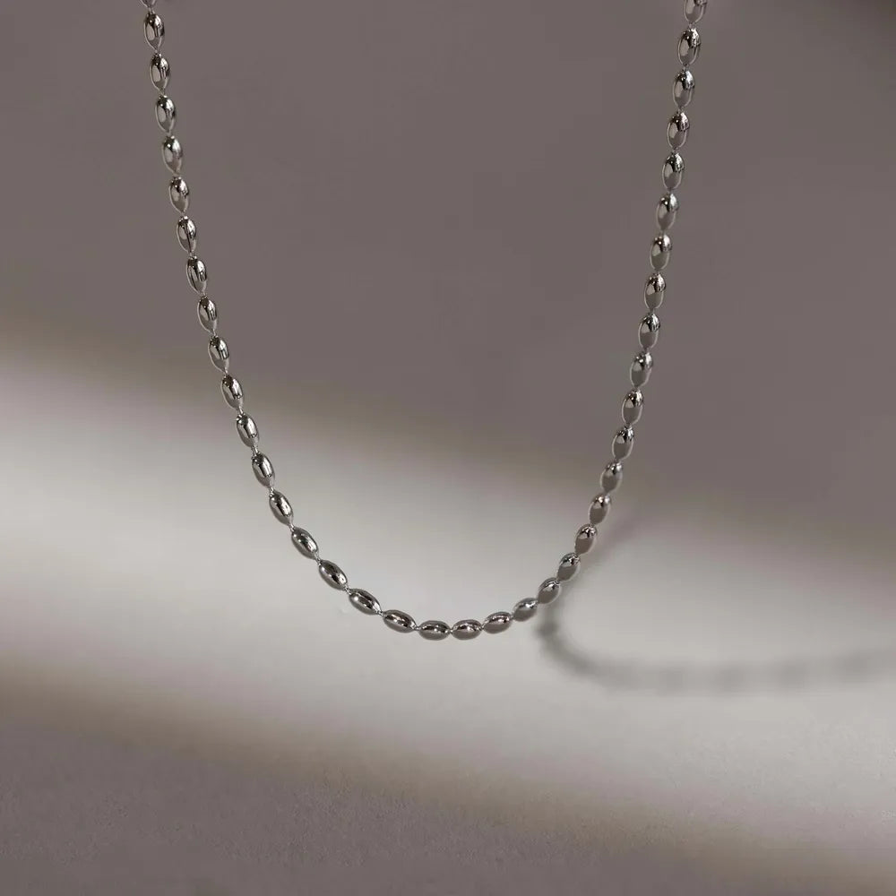 Collier de perles en acier titane - Les secrets de Cath