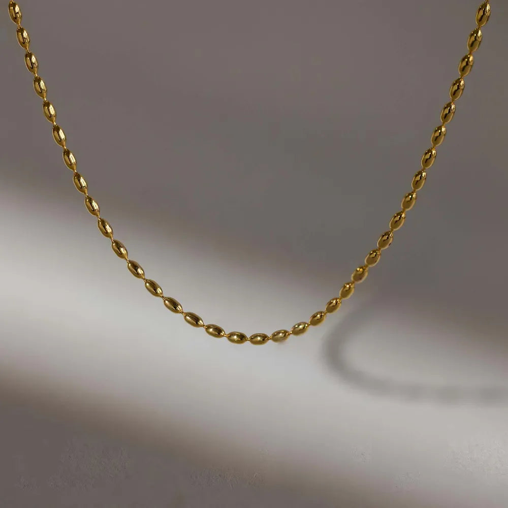 Collier de perles en acier titane - Les secrets de Cath